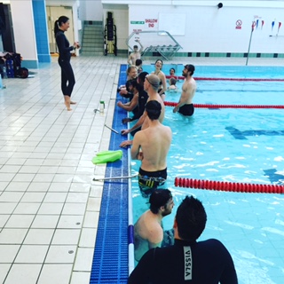 Go Freediving Surf Survival Course students in pool listening to Heather cc