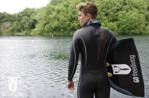 Carl Atkinson wearing Aqua Lung Sport Apnea Freediving suit at Vobster Quay with Go Freediving monofin and neck weight, from behind mid shot 1 for freediving training plan